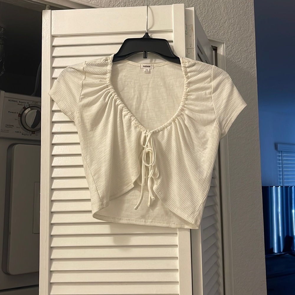 White crop top. Tie in the front. Size small